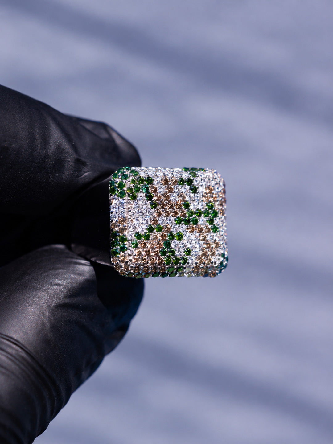Close-up of signature Illoom camo signet ring with pavé green, white and brown diamond camouflage detail, by Illoom Sydney