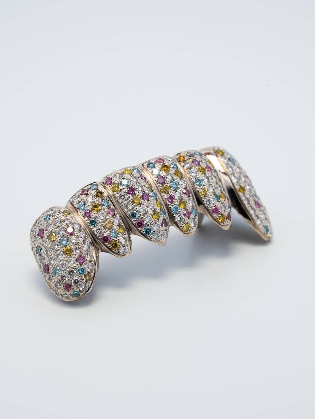 Confetti pavé diamond grillz across the bottom six teeth, multi coloured stones set throughout, bespoke by Illoom Sydney