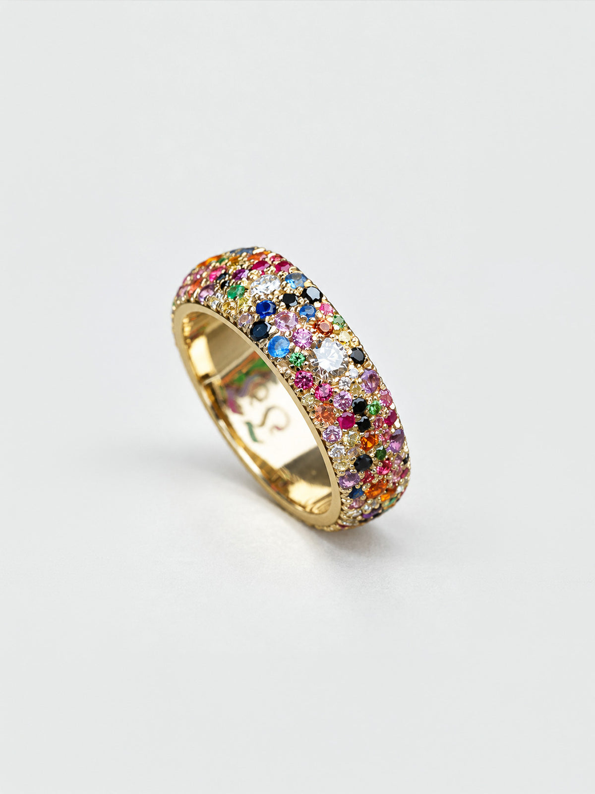 Detail of mosaic set confetti ring in 18k yellow gold, full pavé coverage across the band, by Illoom Sydney