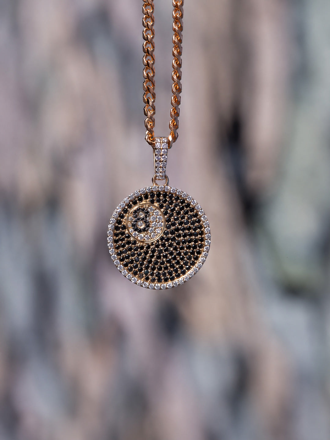 Custom iced-out 8 ball pendant in gold with black and white pavé diamonds, bespoke by Illoom Sydney