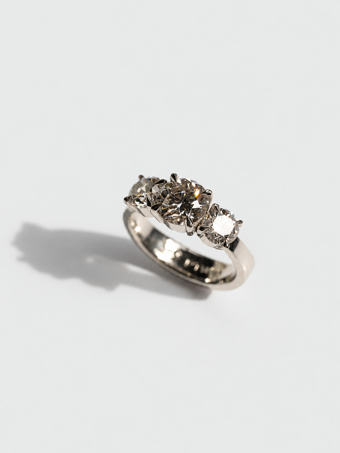 Custom three-stone engagement ring in platinum with diamonds, bespoke by Illoom Sydney