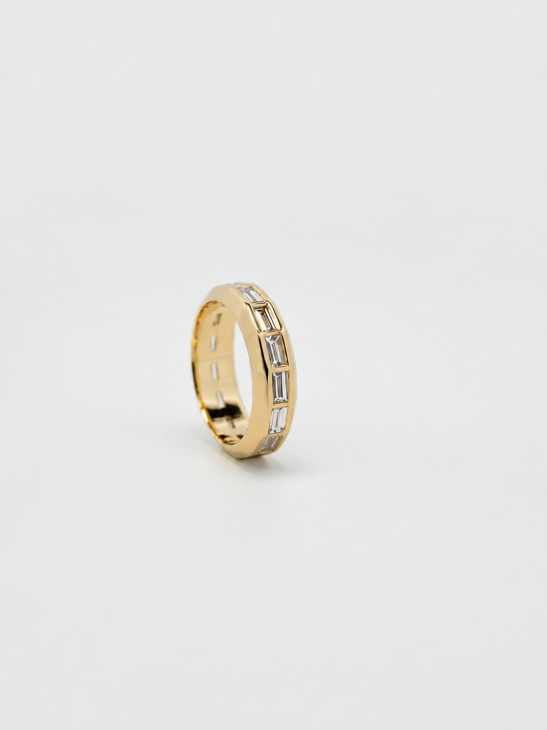 Custom engagement ring in yellow gold with baguette diamond channel band, bespoke by Illoom Sydney