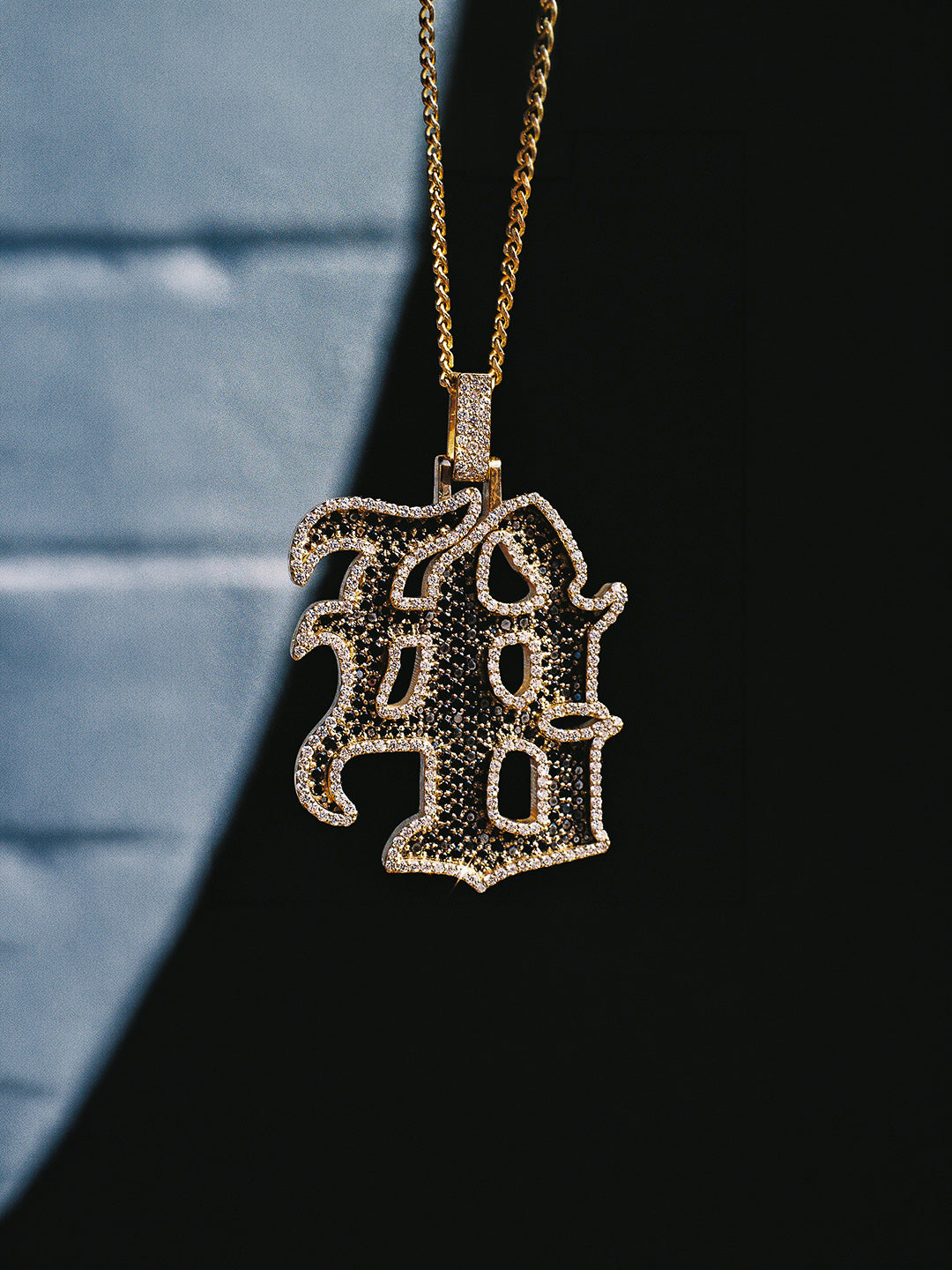 Custom logo pendant hand-crafted in gold with black and white pavé diamonds, bespoke by Illoom Sydney