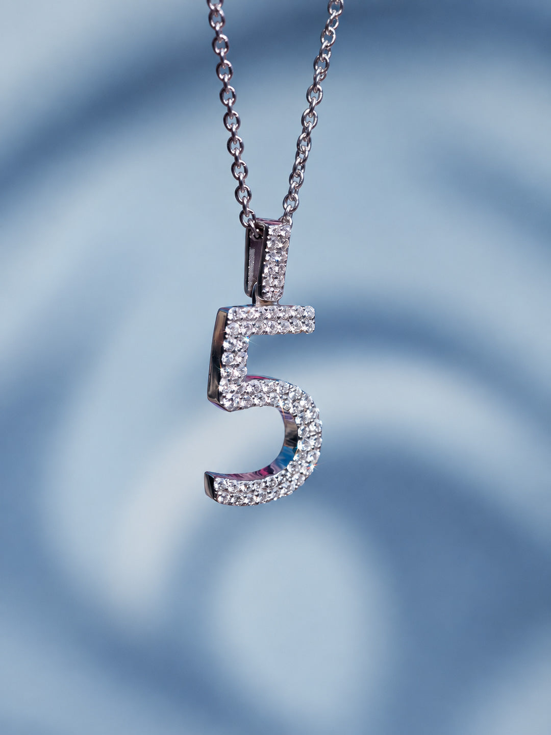 Custom iced-out number pendant in white gold with pavé diamonds, bespoke by Illoom Sydney