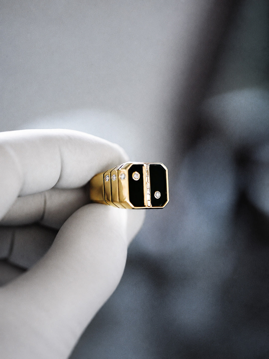 Custom signet ring in yellow gold with onyx inlay and bezel-set diamond accents, bespoke by Illoom Sydney
