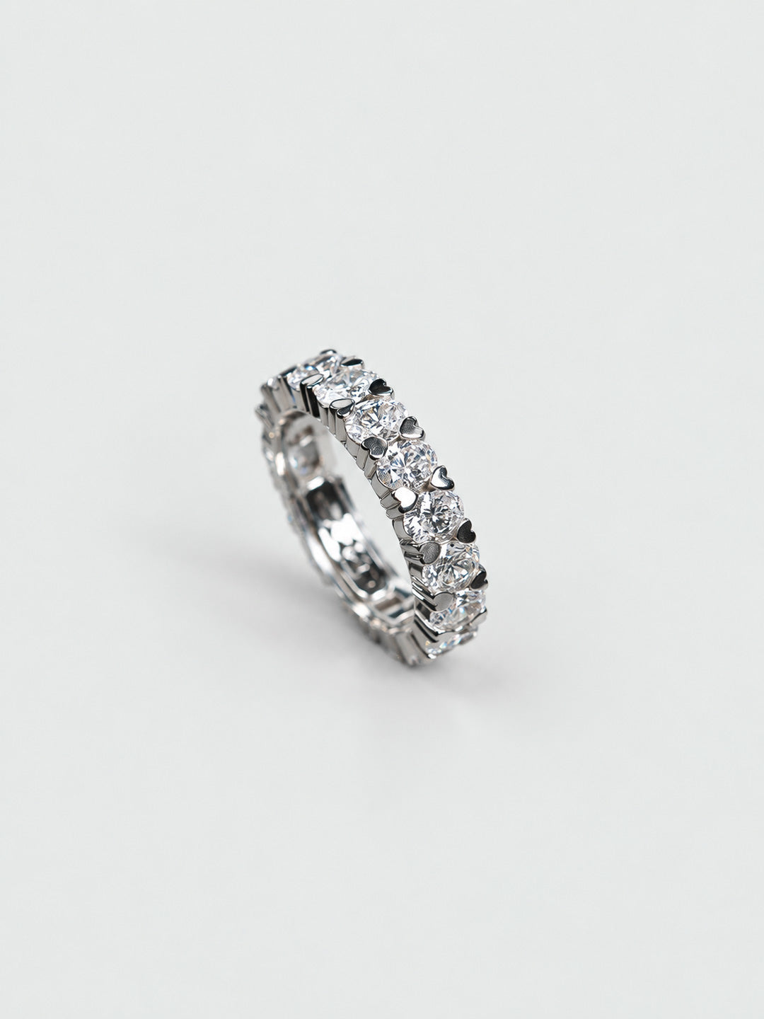 Custom platinum wedding band with diamonds set in heart-shaped claws, bespoke by Illoom Sydney