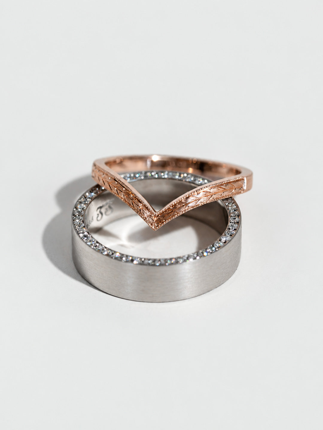 Custom wedding band set, men's platinum diamond eternity band, women's 18k rose gold hand-engraved chevron band, by Illoom Sydney