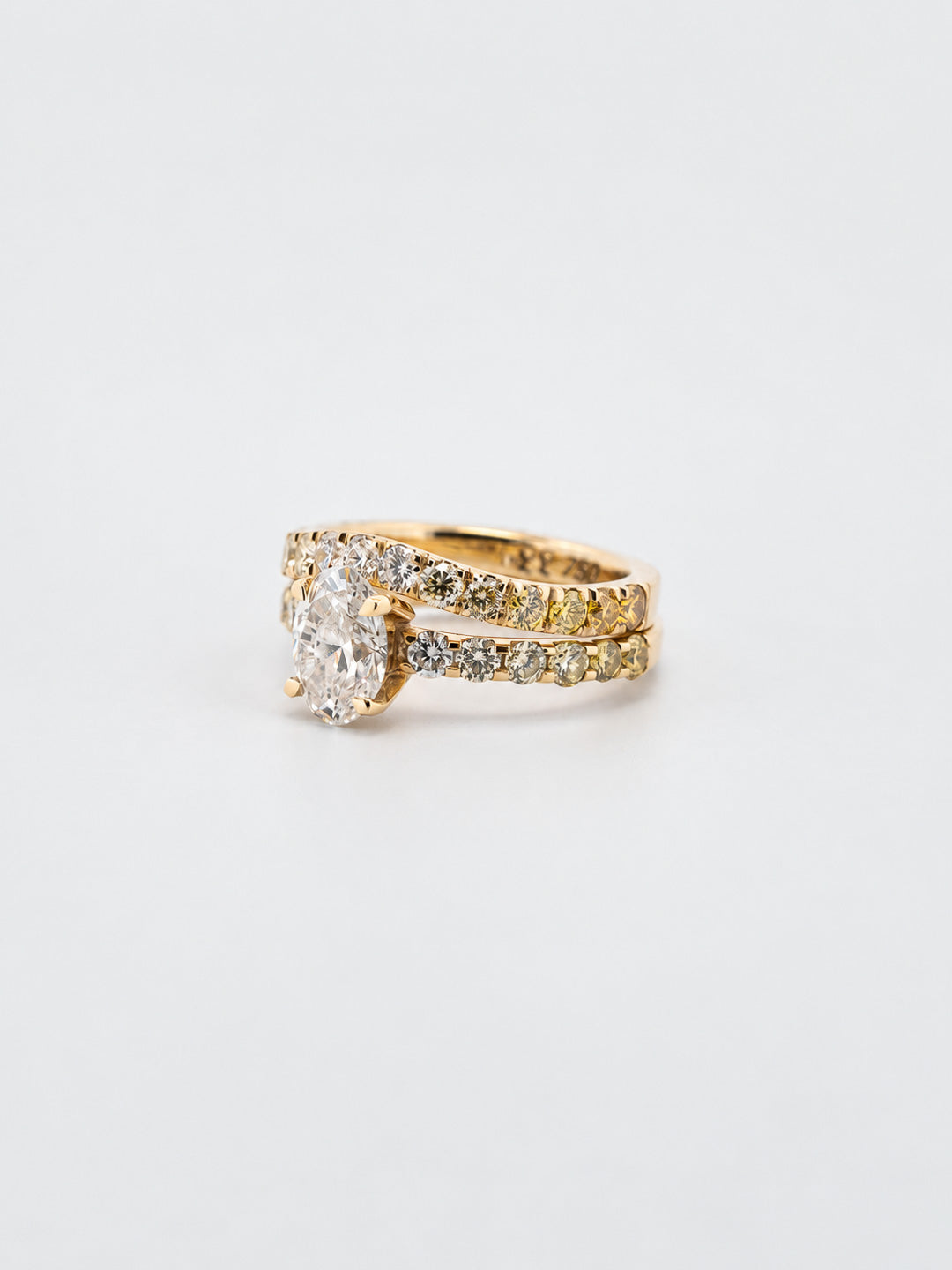 Custom engagement ring and shadow wedding band, 18k yellow gold, natural oval diamond, yellow to white diamond gradient