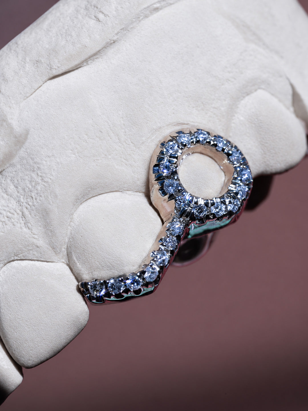 Two tooth diamond window grillz in white gold with a diamond row tip on the second tooth
