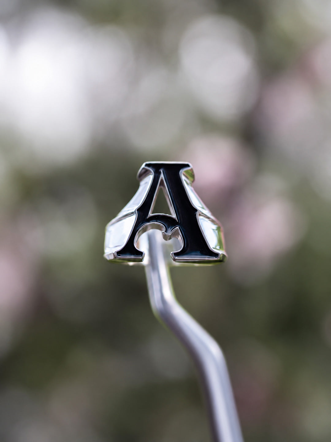 Custom letter-shaped initial ring in sterling silver with black enamel letter A, by Illoom Sydney