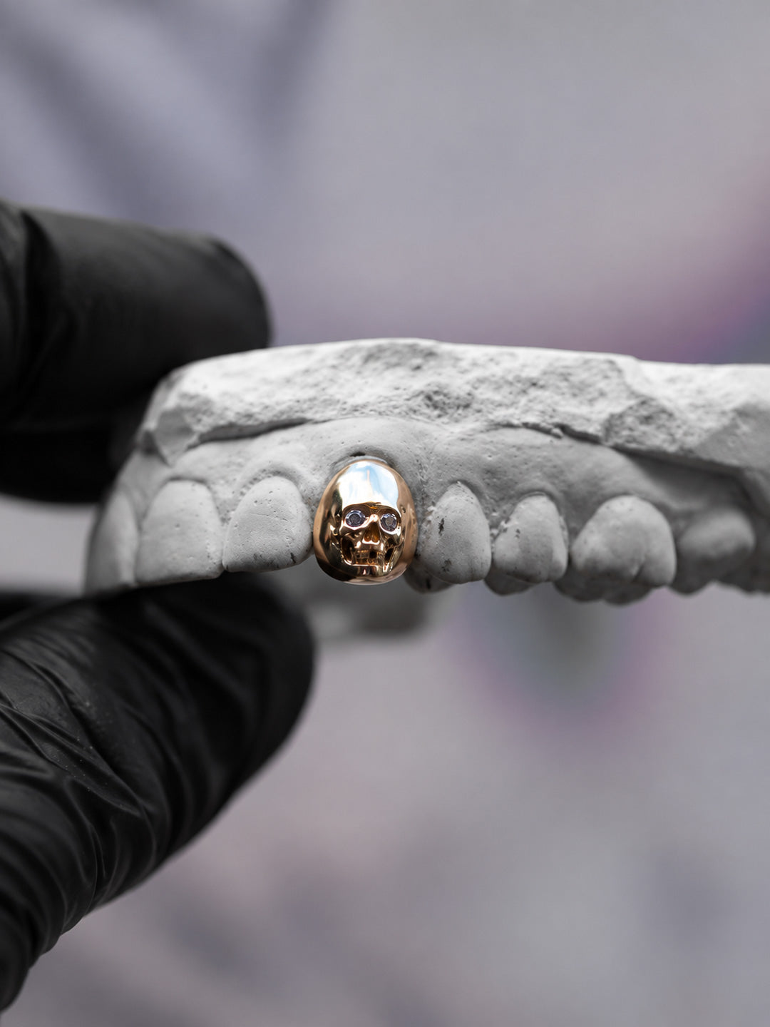 Skull grillz in yellow gold with diamond set eyes, single tooth custom design, bespoke by Illoom Sydney