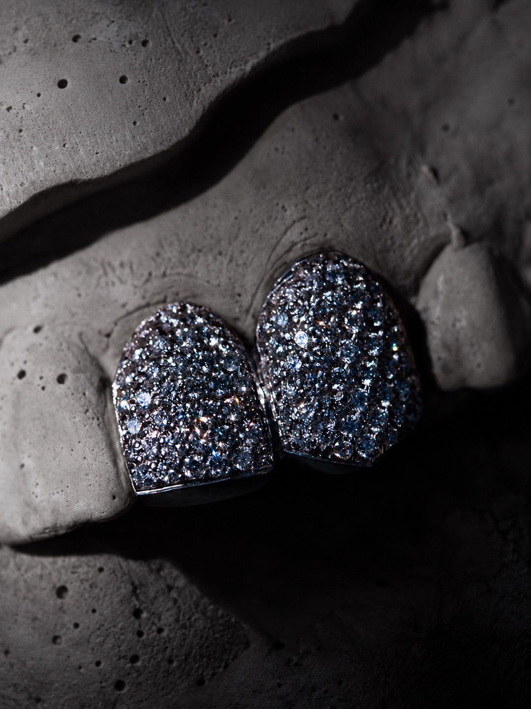 Two tooth VVS diamond grillz in 9k white gold, fully pavé set, close detail view